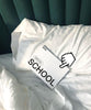 DROOL school booklet on a bed