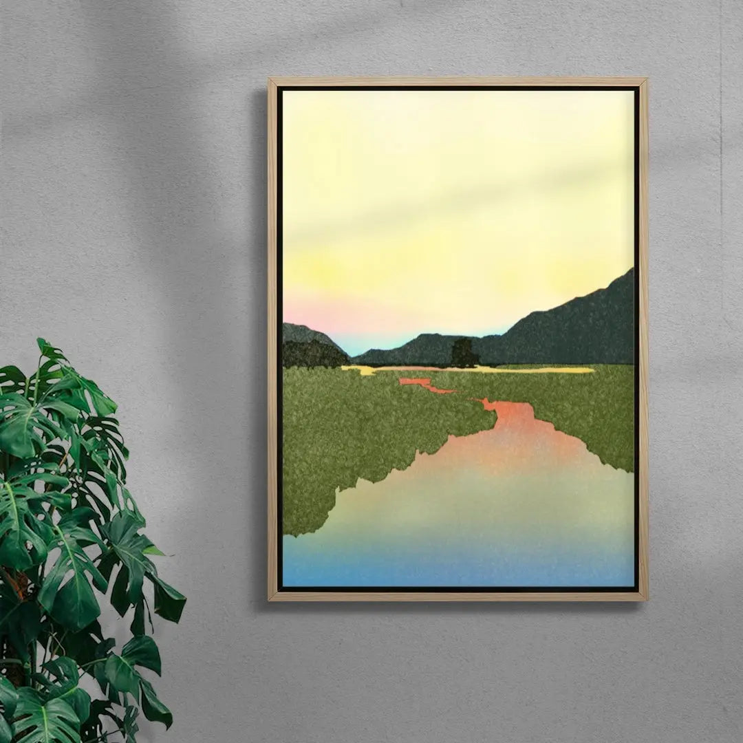 Framed artwork of a landscape with mountains and a river on a gray wall.