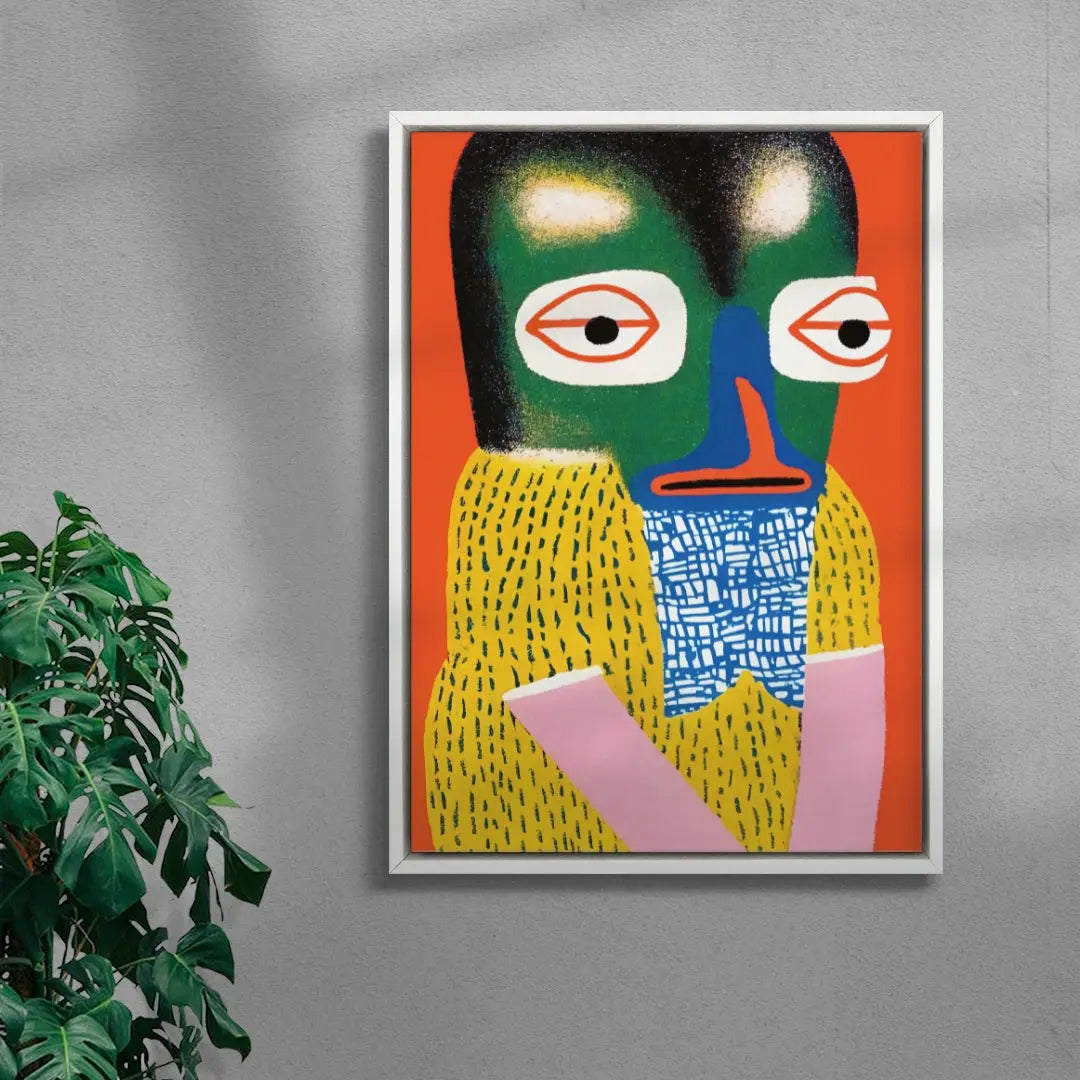Abstract artwork with a colorful face on a gray wall next to a plant