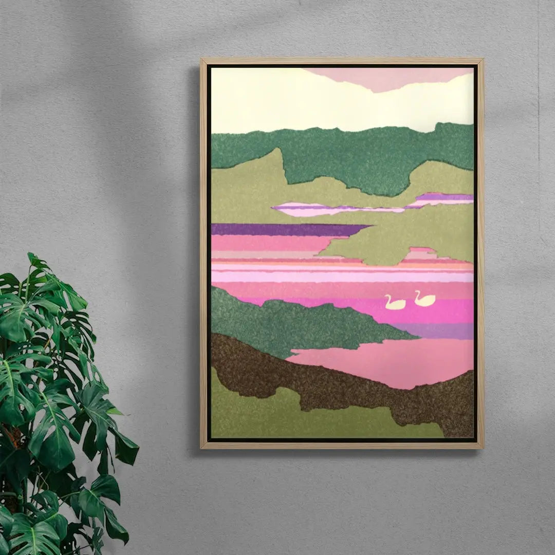 Framed abstract landscape art on a gray wall with a plant to the left.