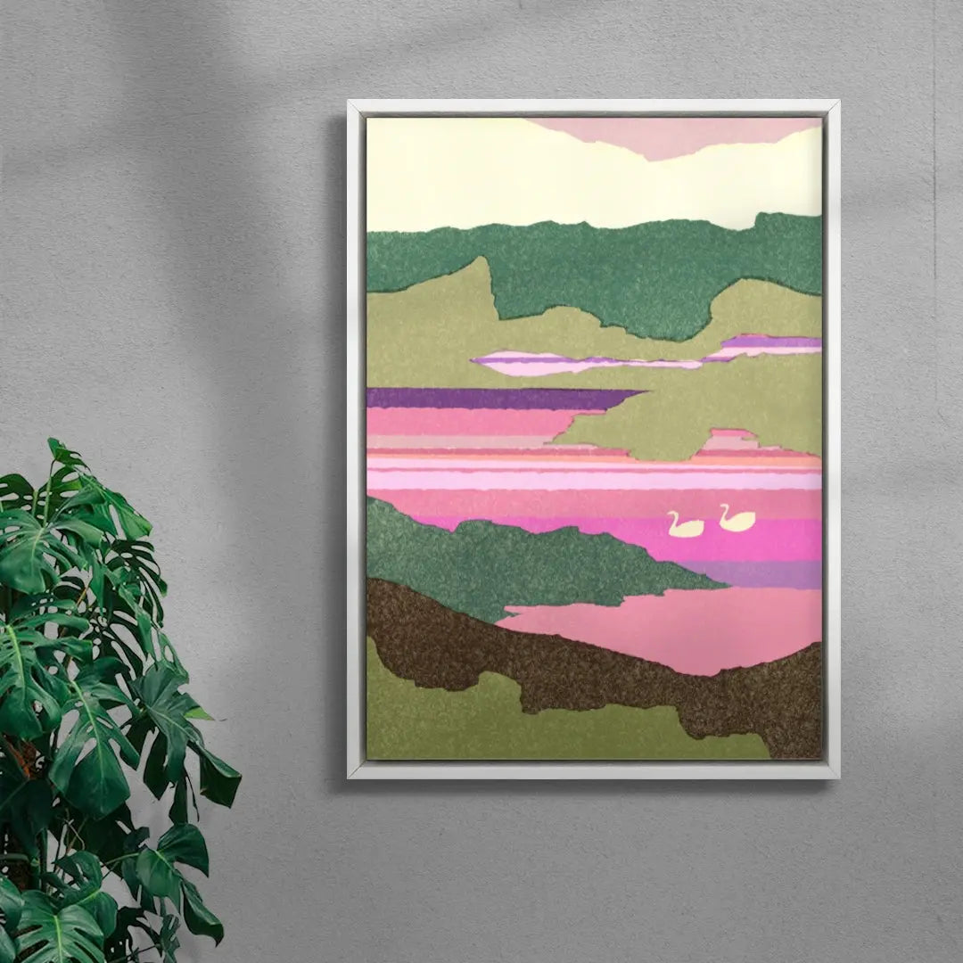 Framed abstract landscape art on a gray wall with a plant to the left.