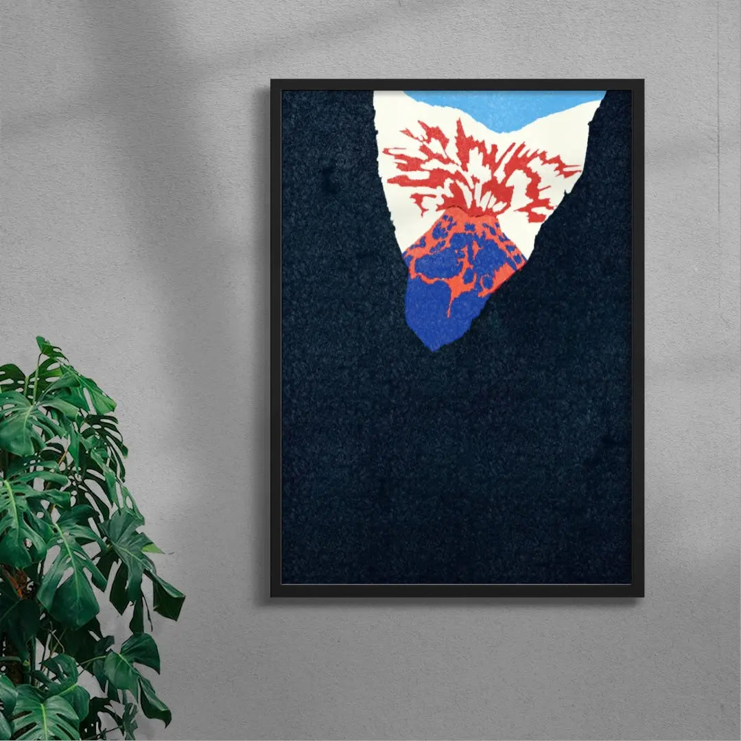 Framed abstract art piece with red, white, and blue colors on a dark background, leaning against a gray wall with a plant to the left.