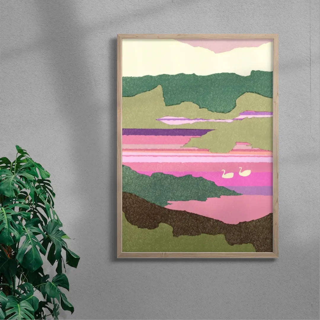 Framed abstract landscape art on a gray wall with a plant to the left.